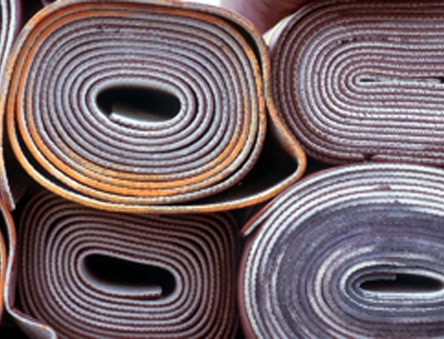Old carpet ready to be removed from a home.