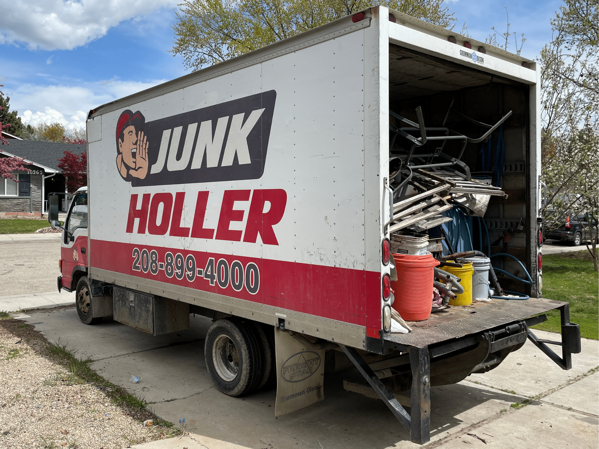 Truck filled with scrap metal being removed in Boise, ID.